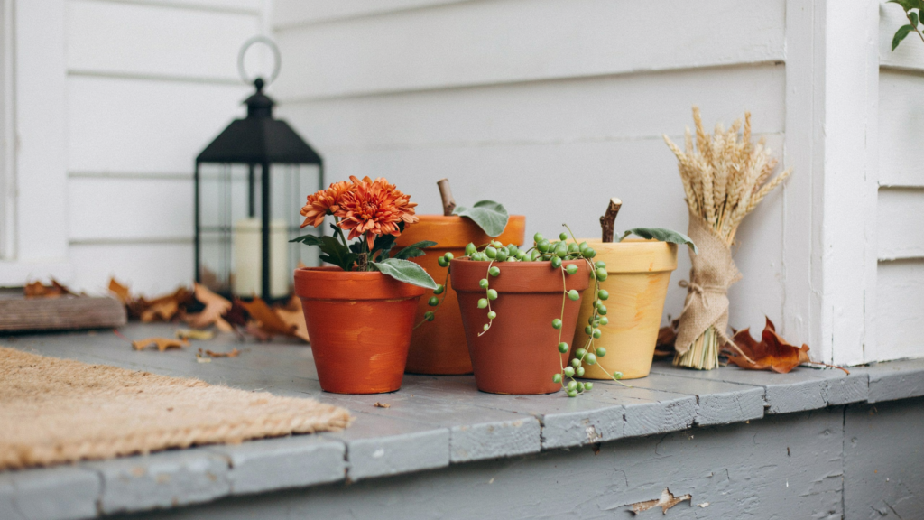 pumpkin terracotta pots made with pained inexpensive clay pots into adorable pumpkins that add warmth and character to your home.