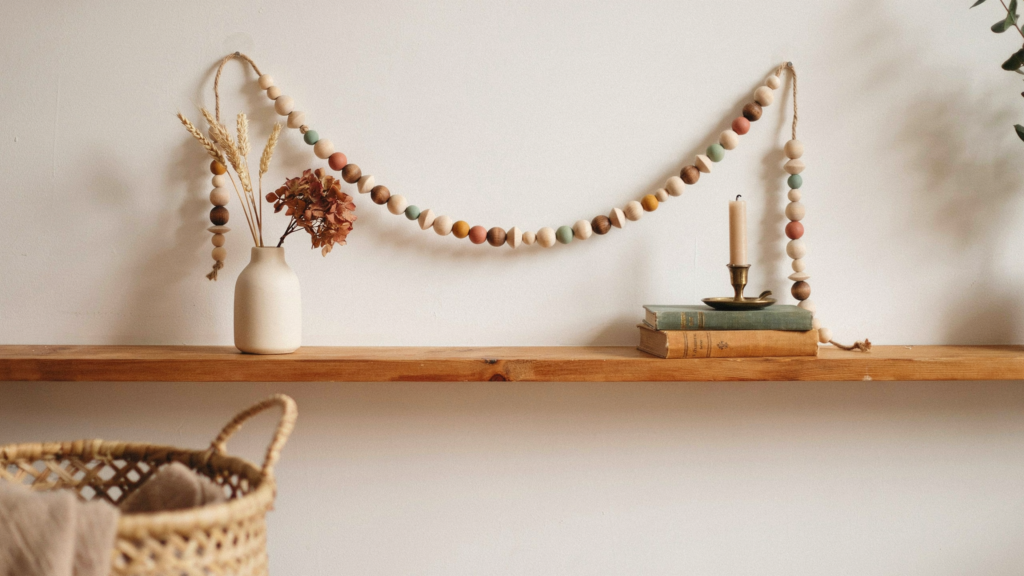 A custom wooden bead garland that adds warmth and texture to your fall décor by mixing natural wood with soft autumn colours