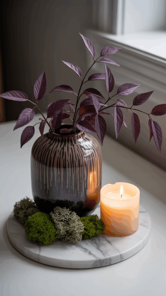 purple stems arranged in vase on a counter