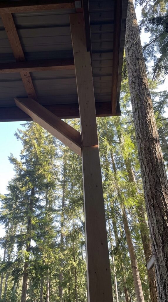 newly painted patio cover roof structure before painting with wood beams and metal panels above fifth wheel trailer
